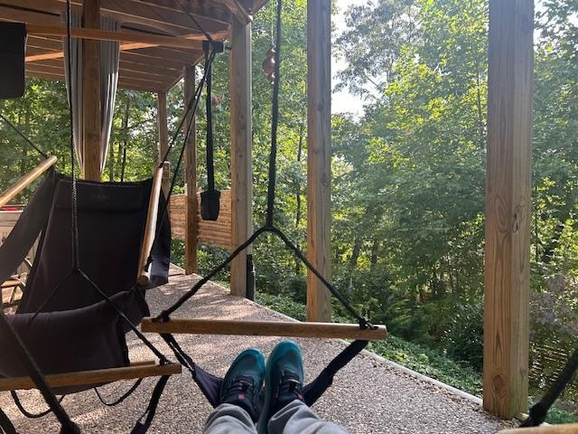 Awesome swing chairs to chill in beneath the deck next to the hot tub.