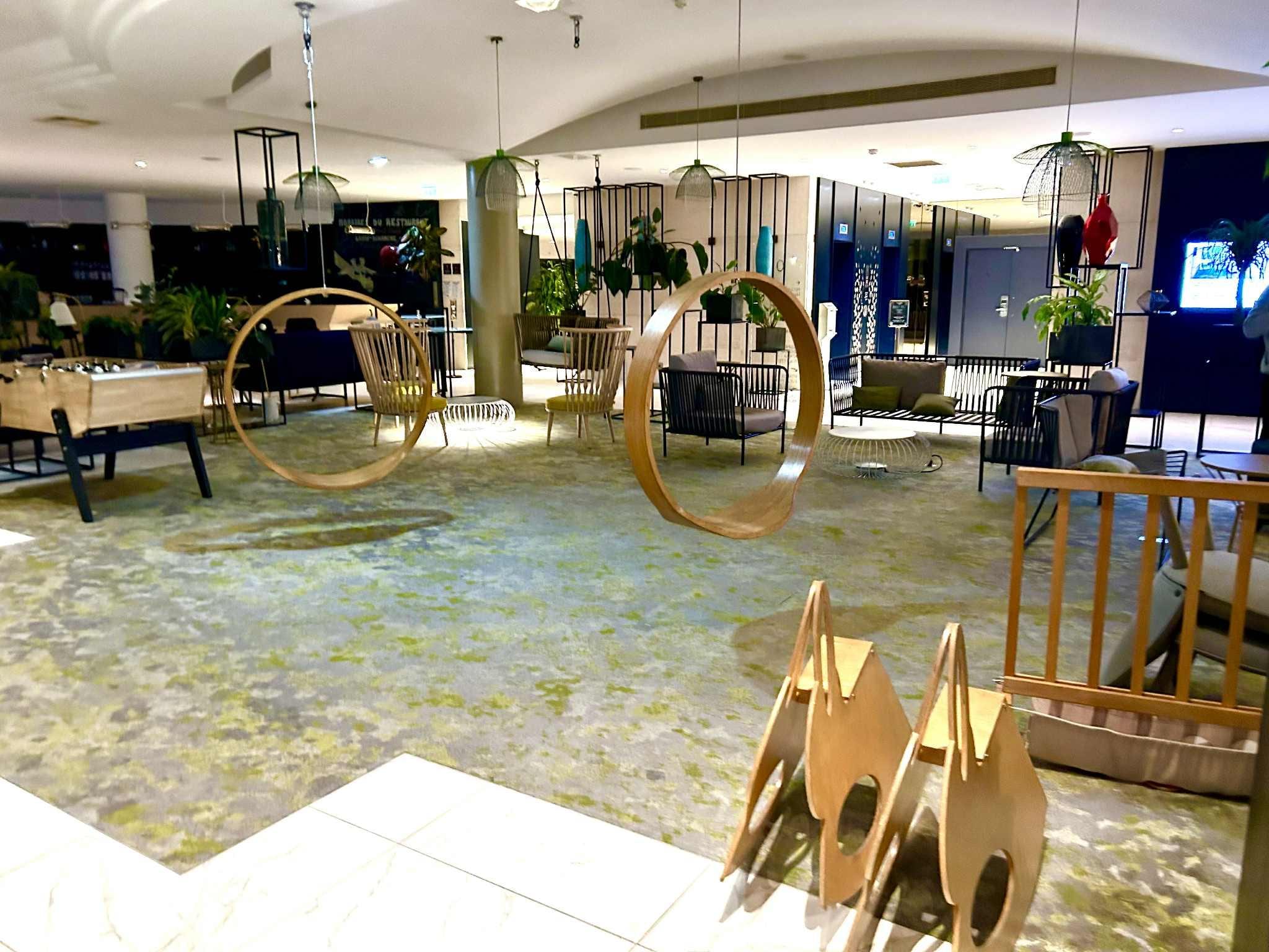 Really cut lobby with fun swings and rocking horses for kiddos.