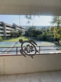 Lanai overlooking the tennis court. There are 2 other sliding doors that goes out to the Lanai.