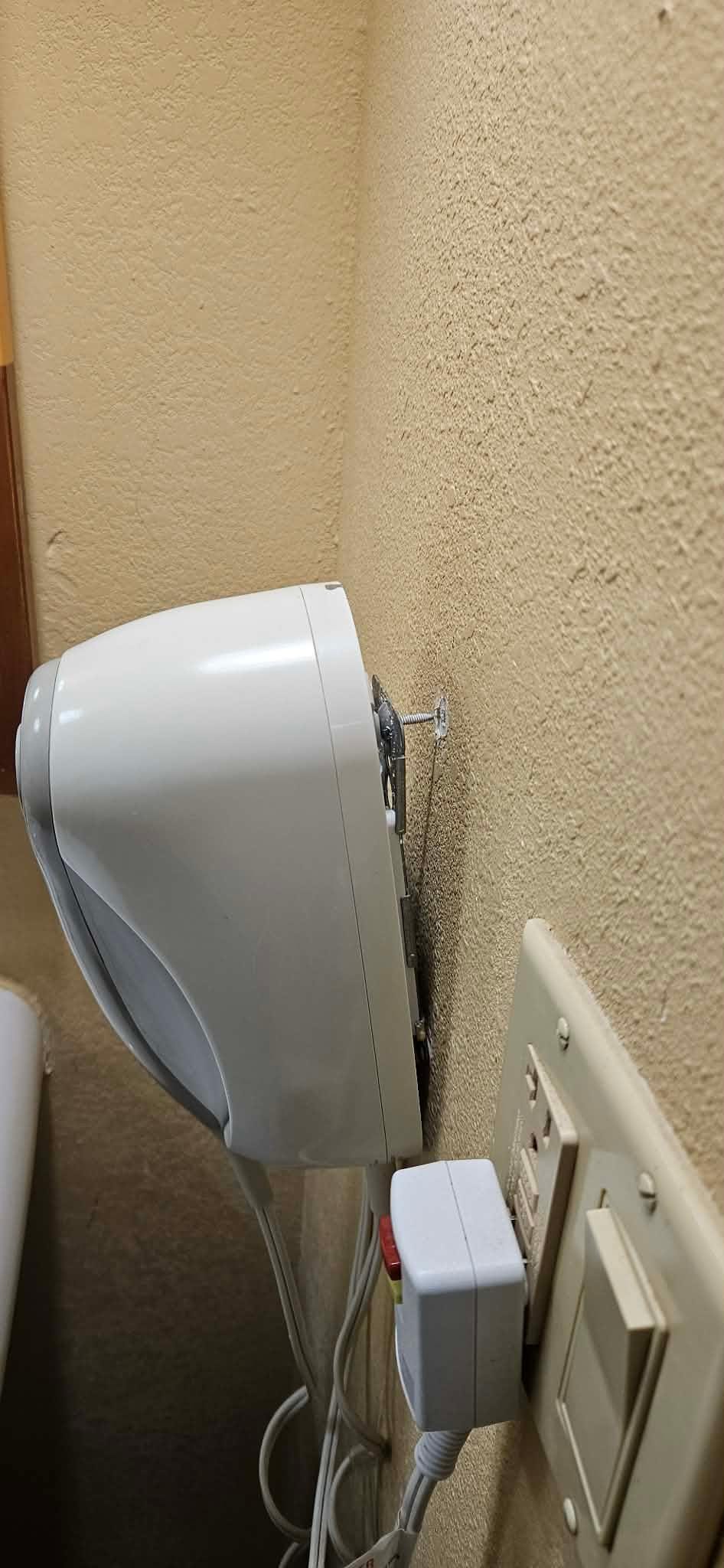 Hair dryer literally hanging off the wall