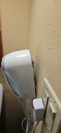 Hair dryer literally hanging off the wall