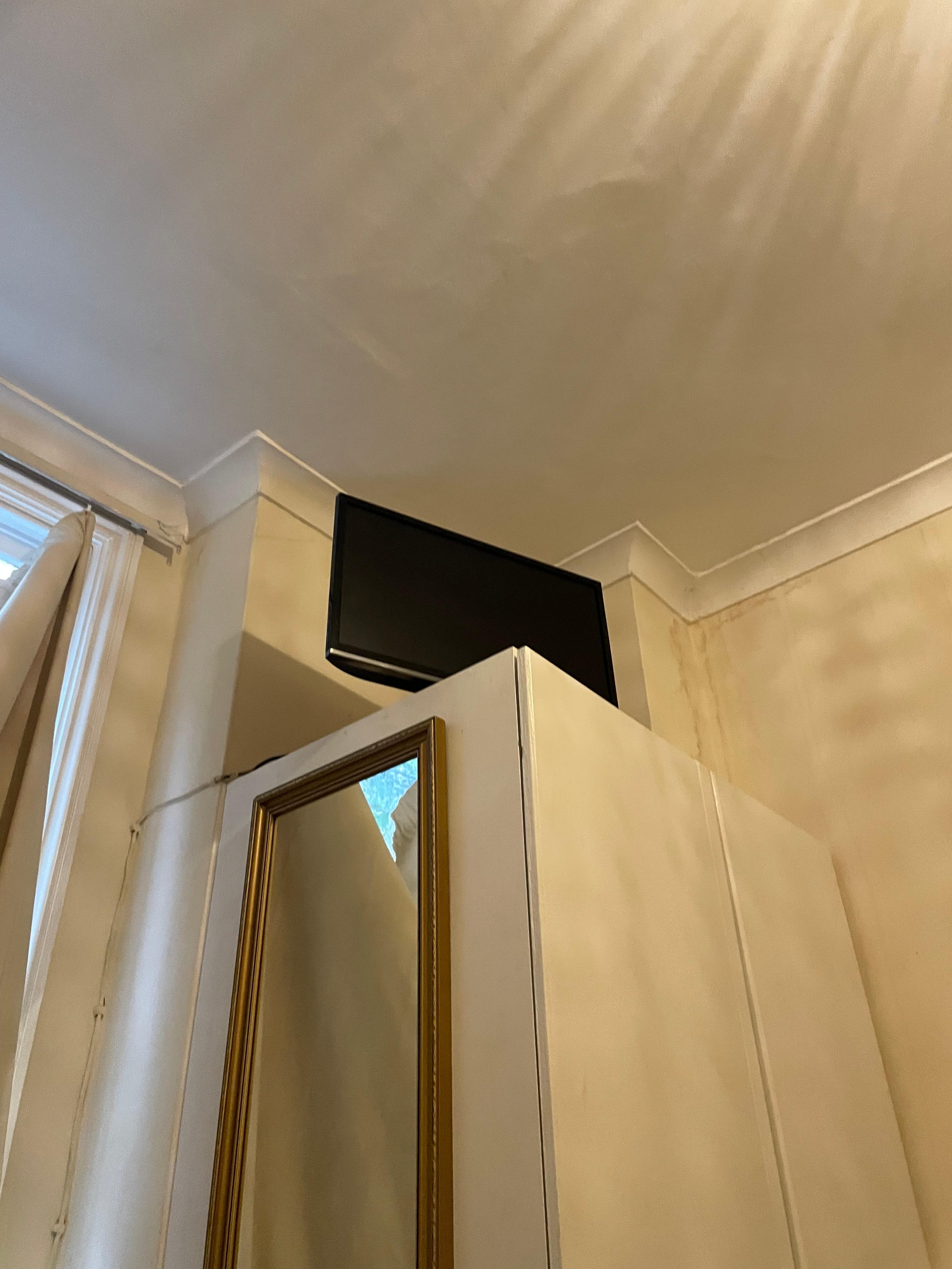 Tv to high to watch and cupboard corner in way