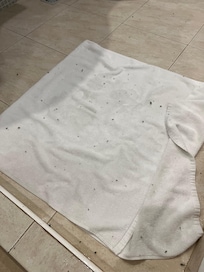 Fluff balls falling from my bath towel onto the floor mat