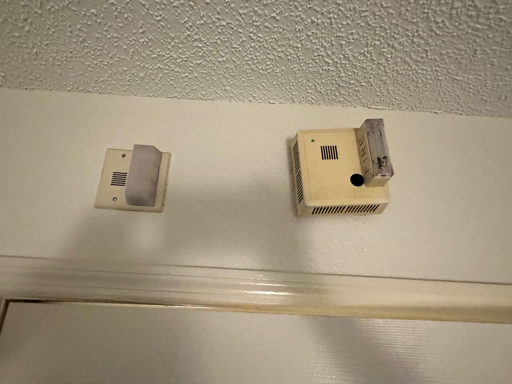 Old smoke detector and new both still hung. 