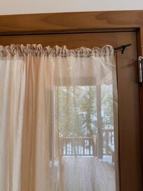 Broken curtain rod. Every time you opened the door or brushed by the curtain it would fall off.