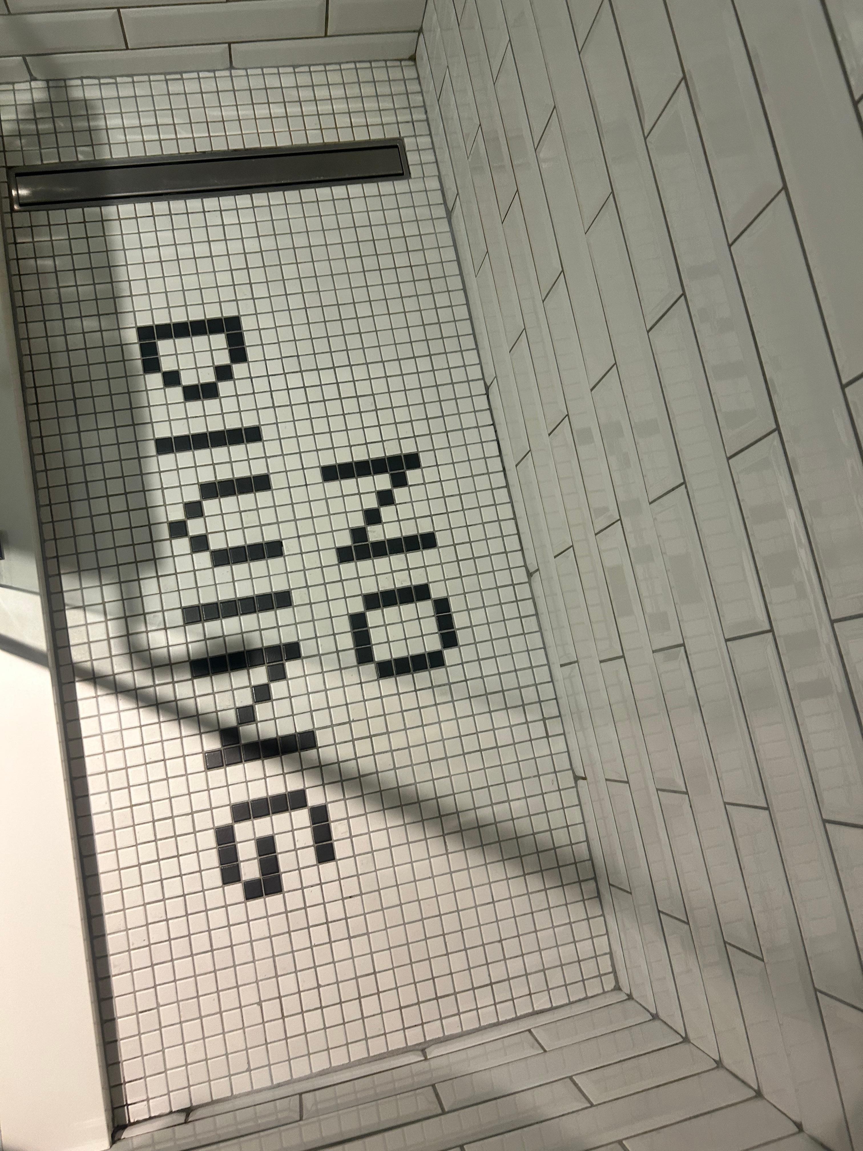 Cool mosaic detail on shower floor