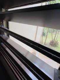 Thick layer of dirt on blinds & windowsill