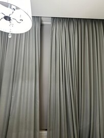 Thin curtains on a huge drafty noisy window and did not close.