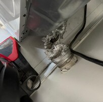Broken dryer flue enabling fumes to fill room
