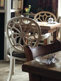 Eclectic mix of chair styles in the dining area
