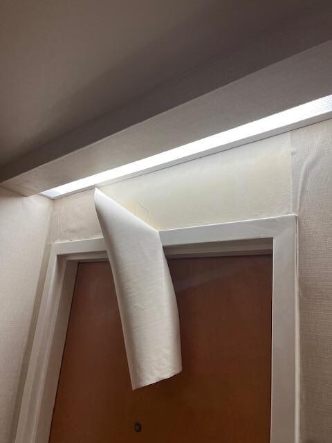 Hallway wallpaper is peeling, humidity and mold