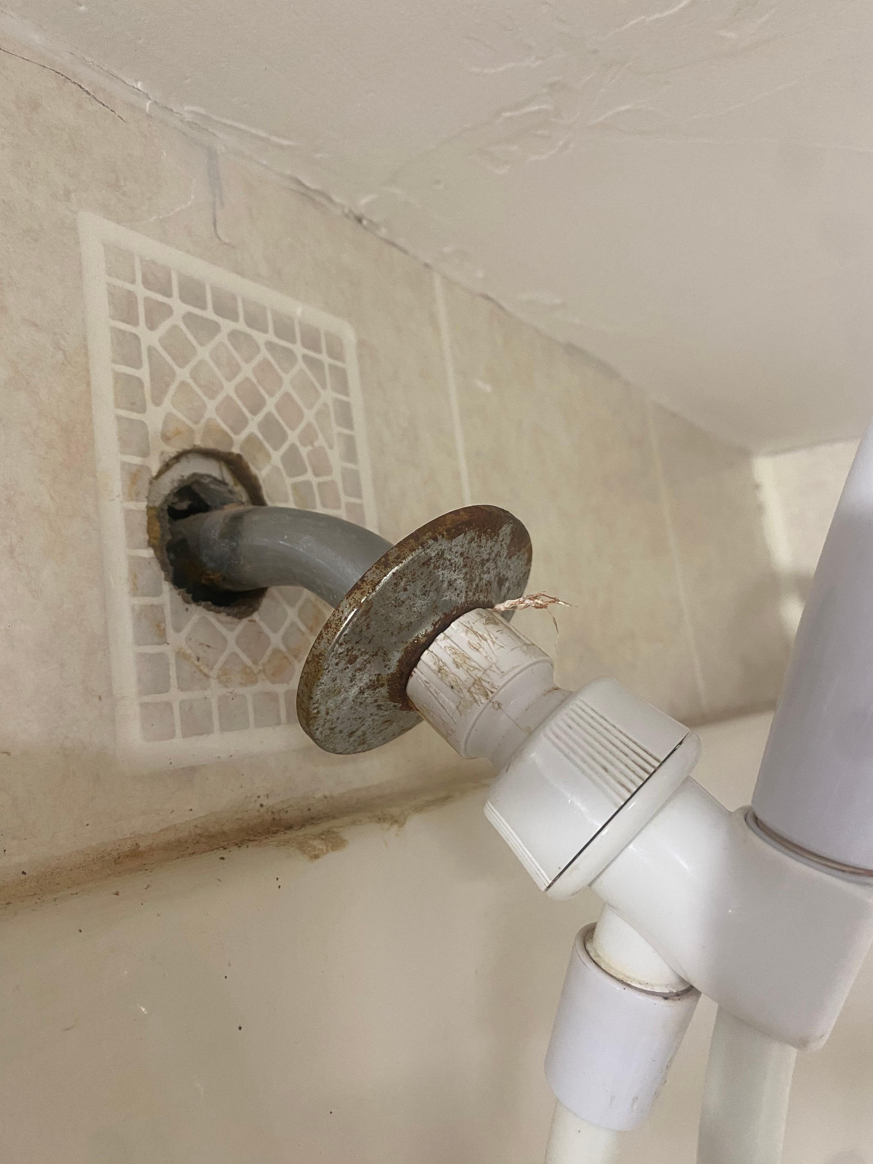 Shower head that pretty much touched the ceiling and was assembled like this.