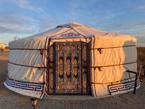 Outside the blue yurt