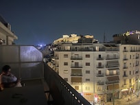 Slightly left from the balcony