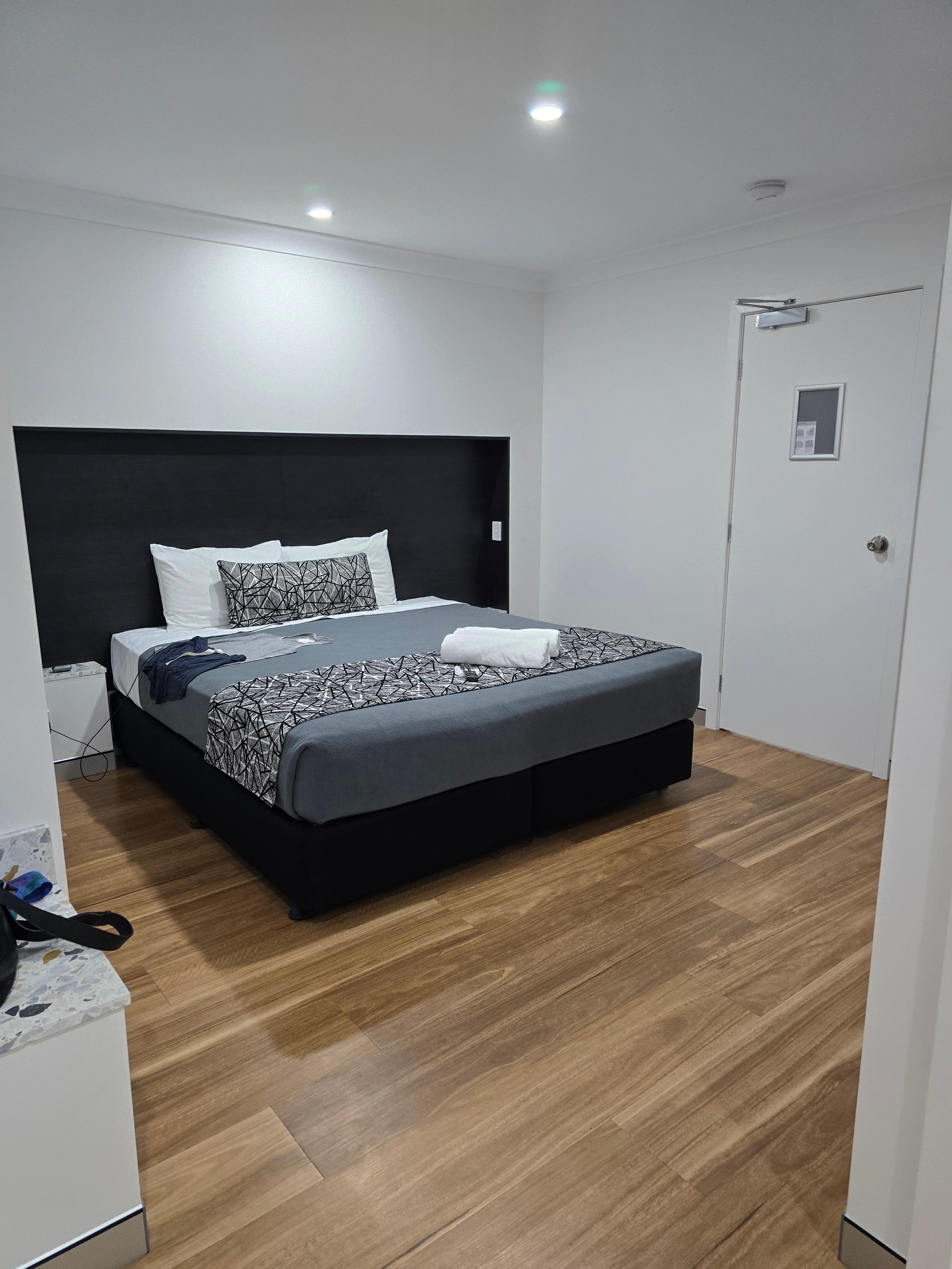 King bed, TV on wall