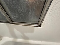 Mildewed, loose window frame