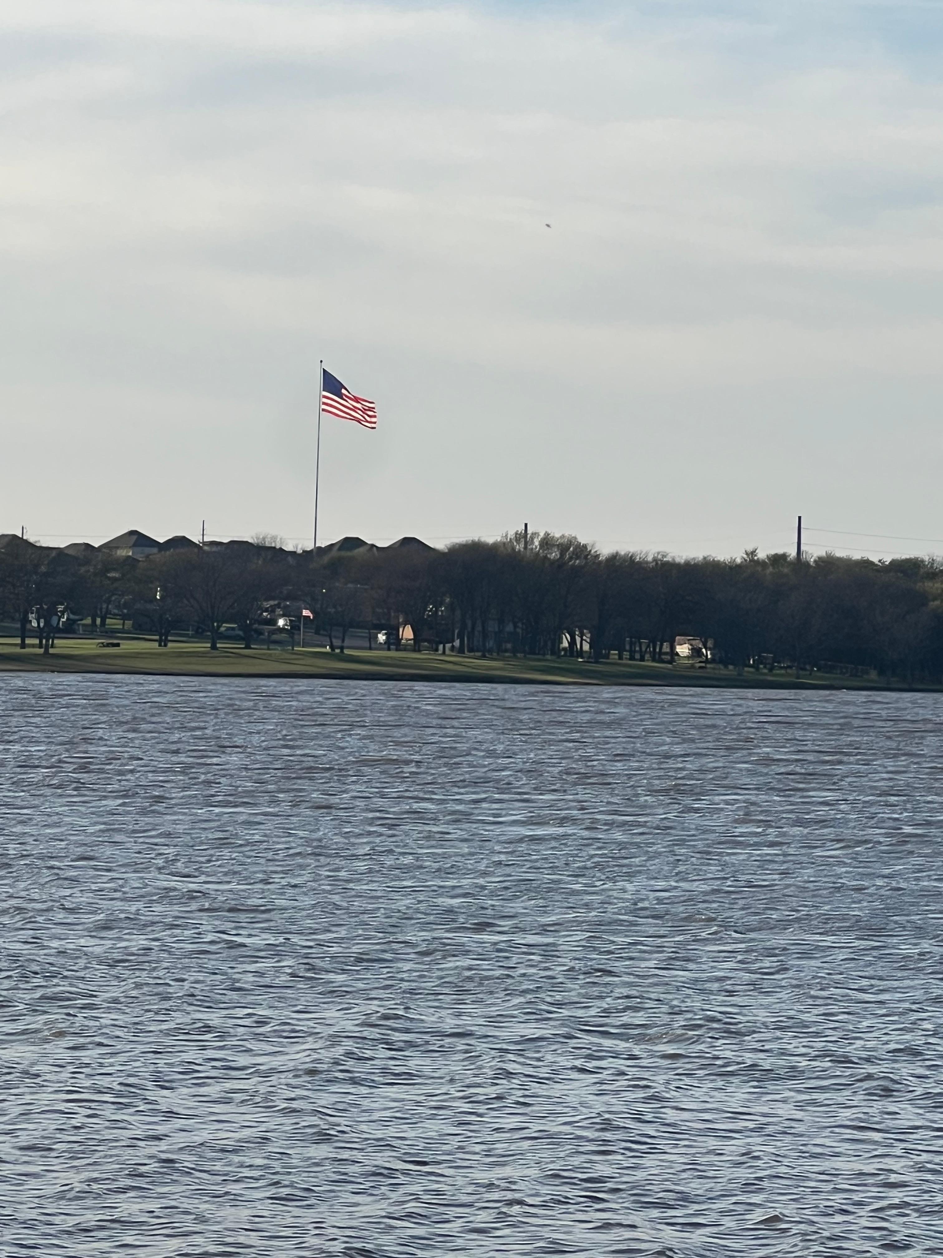 Old Glory across the lake