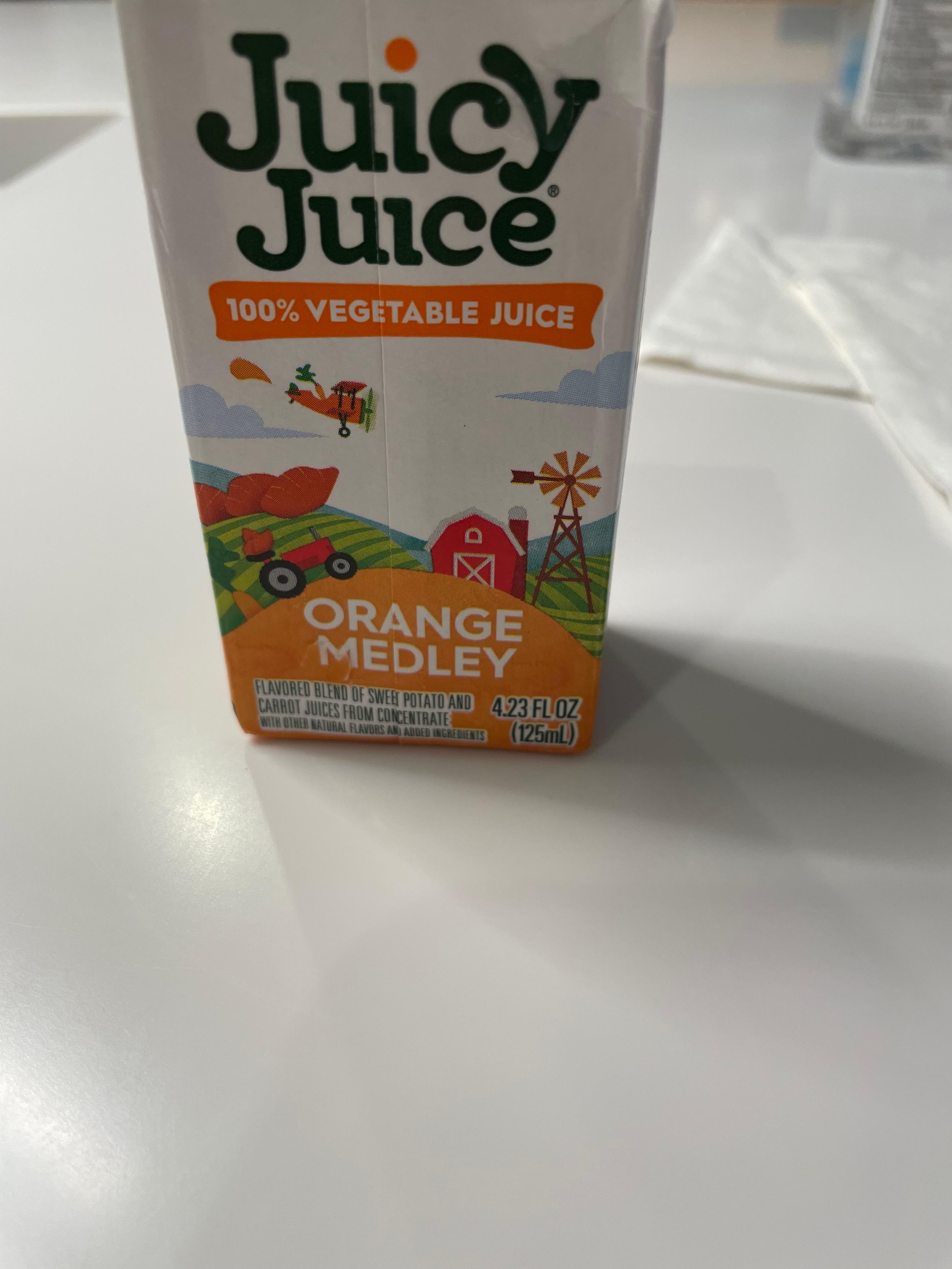 Orange juice made with/sweet potatoes and carrots. 
