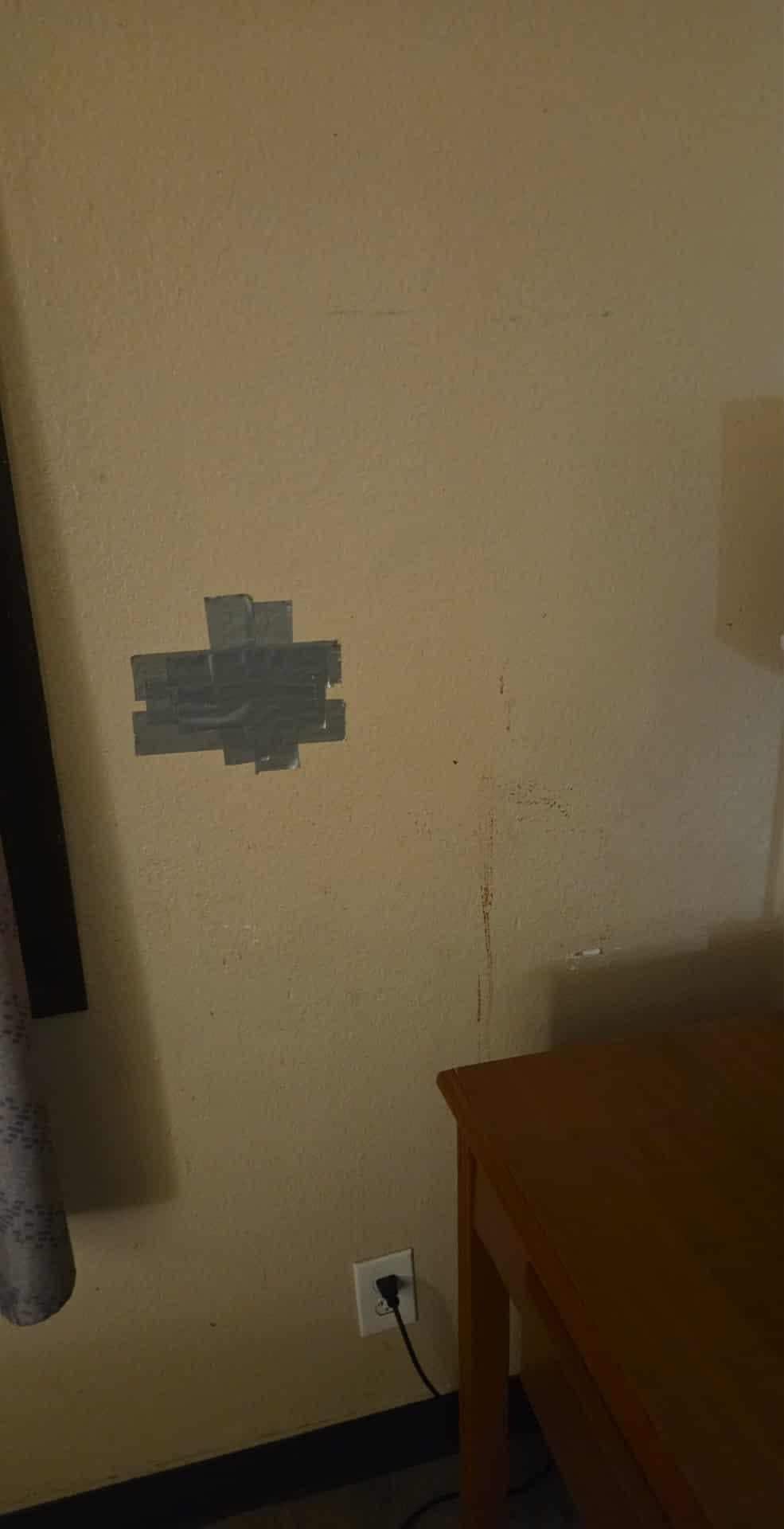 Hole covered with duct tape 