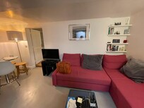 The living room has a convertible sofa. There is a tv and WiFi. Also dining area.