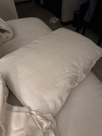 Pillow provided without a clean pillowcase.