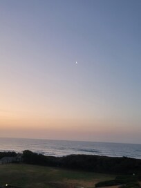 Sunrise with the moon still visible.