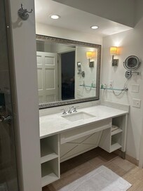 Lovely vanity with regular mirror and attached lighted makeup mirror