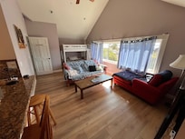 View from the entry towards the living room with bunk beds