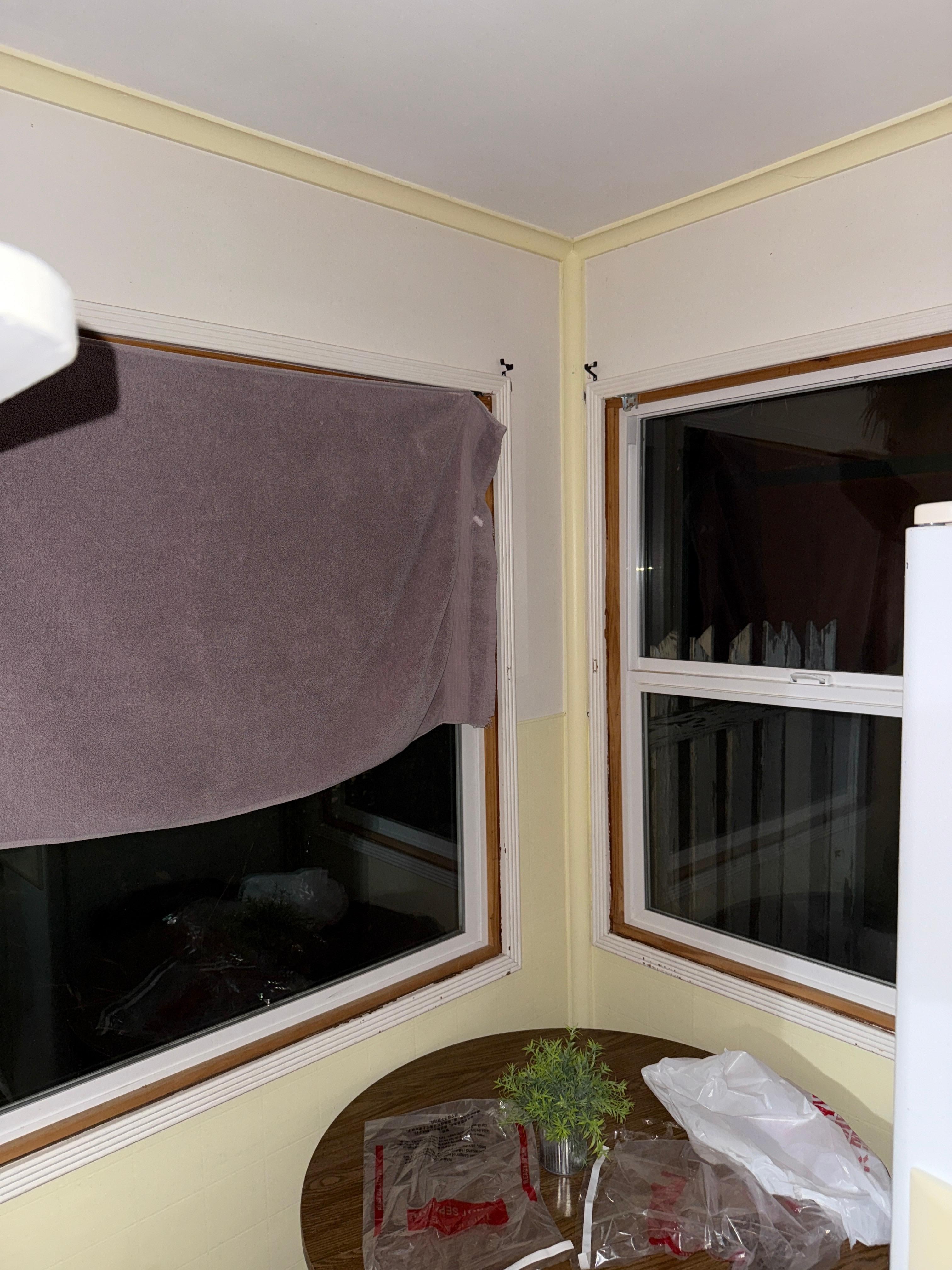 No curtains on the windows!? Yep people on the street could see right through into the kitchen and living room. The bath towel is our attempt to have a little privacy