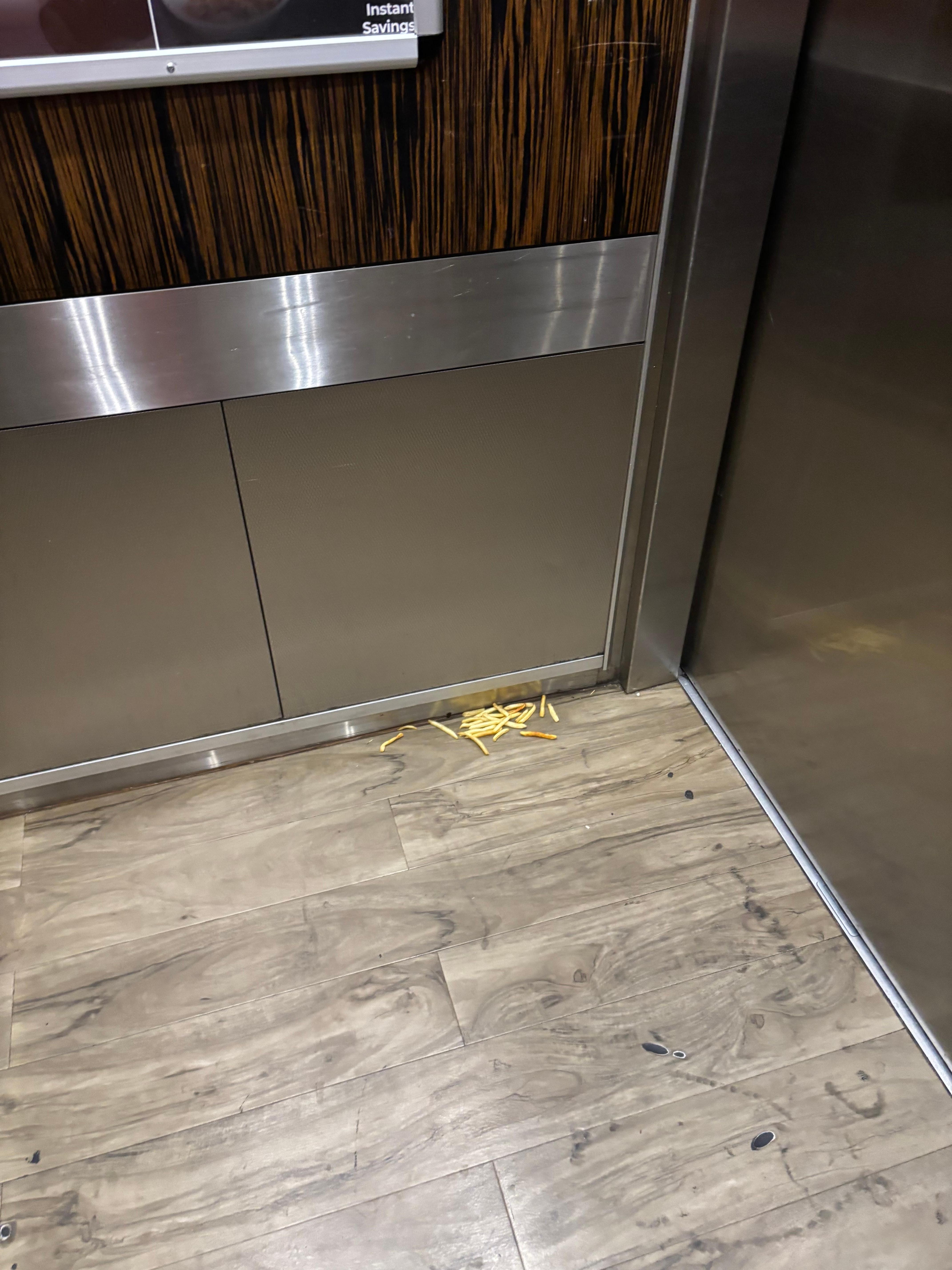 Elevator with food on the floor 