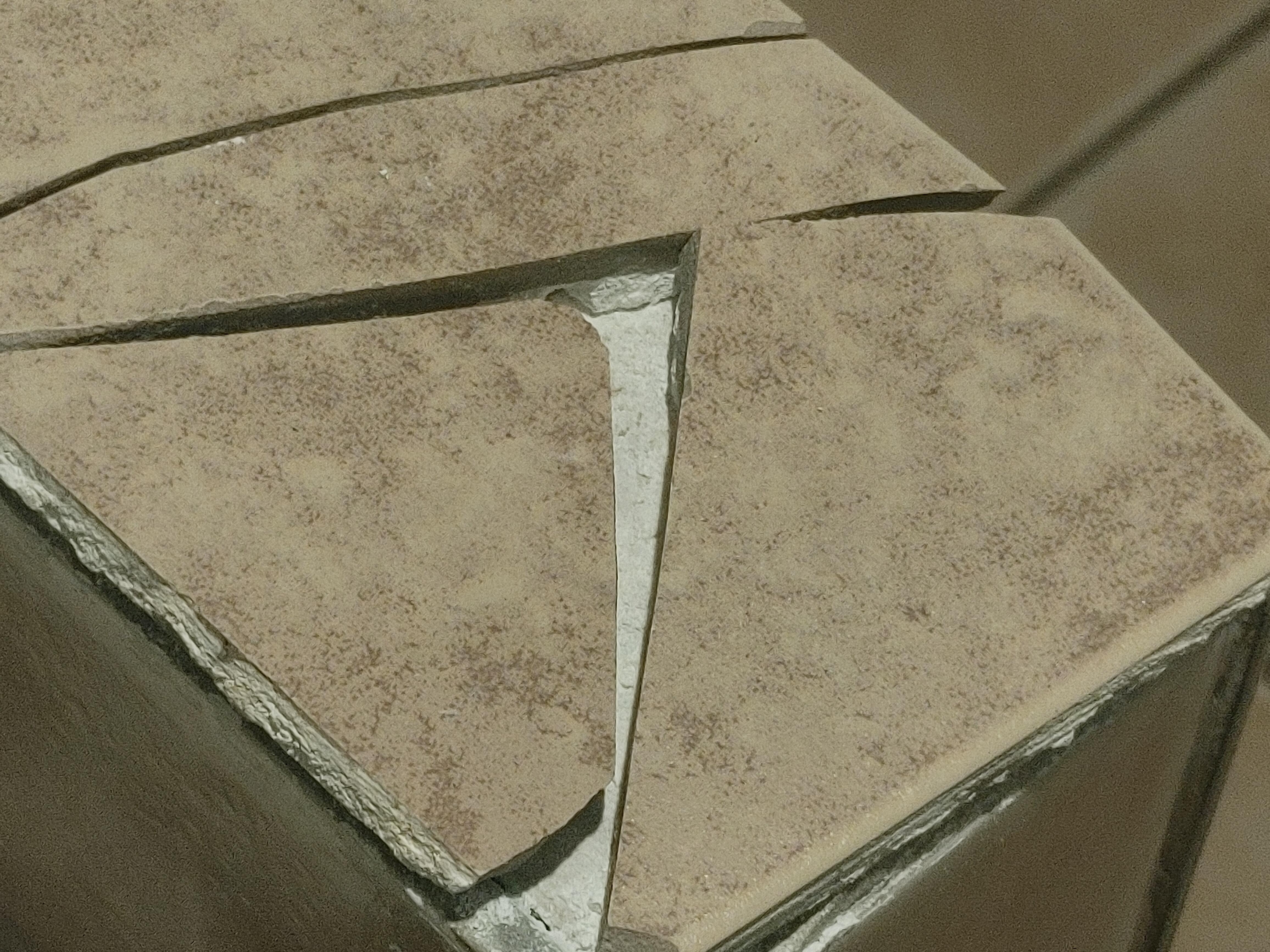 Cracked tile by toilet
