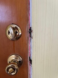 Gap between door & frame in bedroom’s exterior door that leads to upper deck