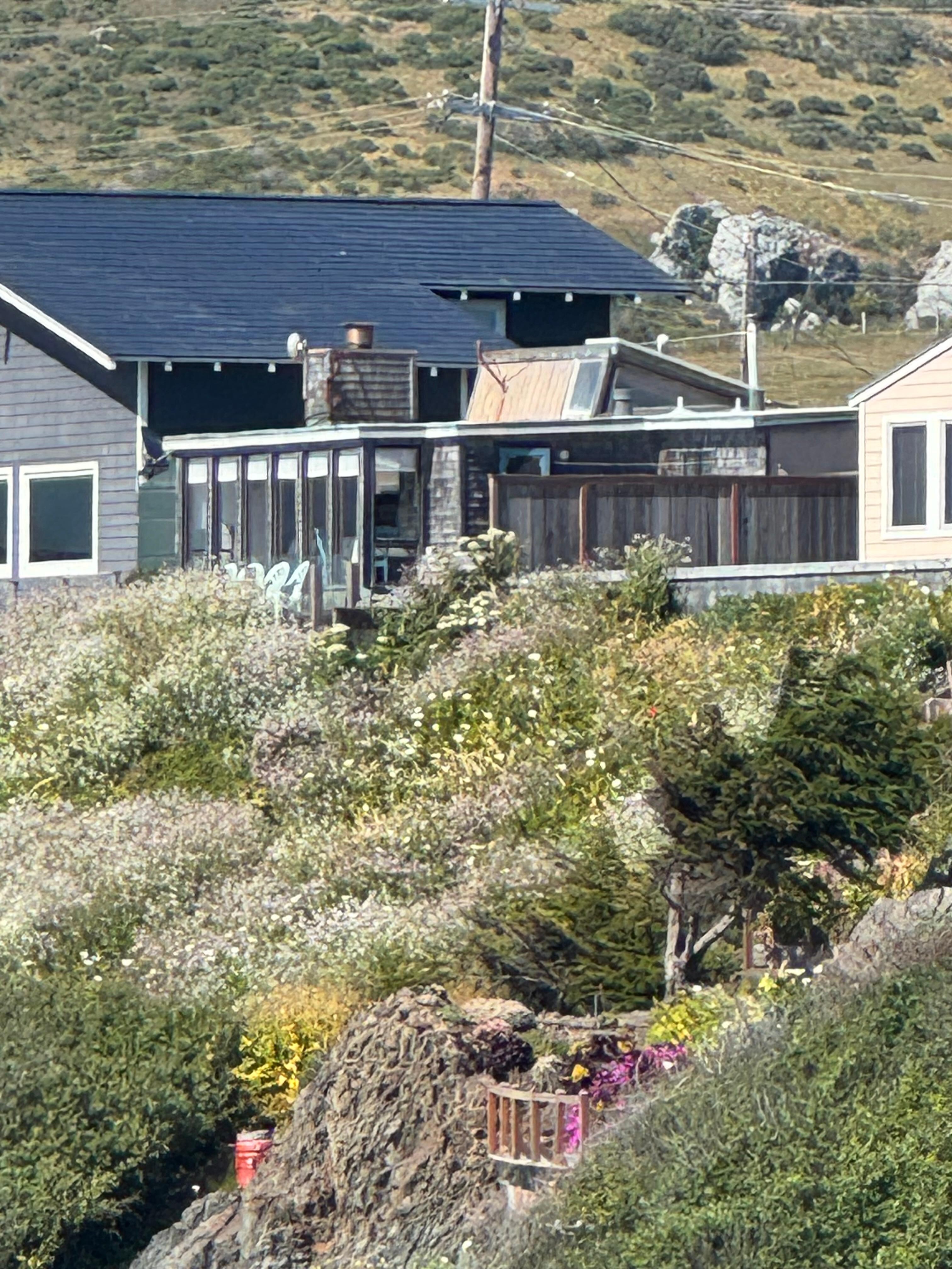 view of the house from the path to the beach