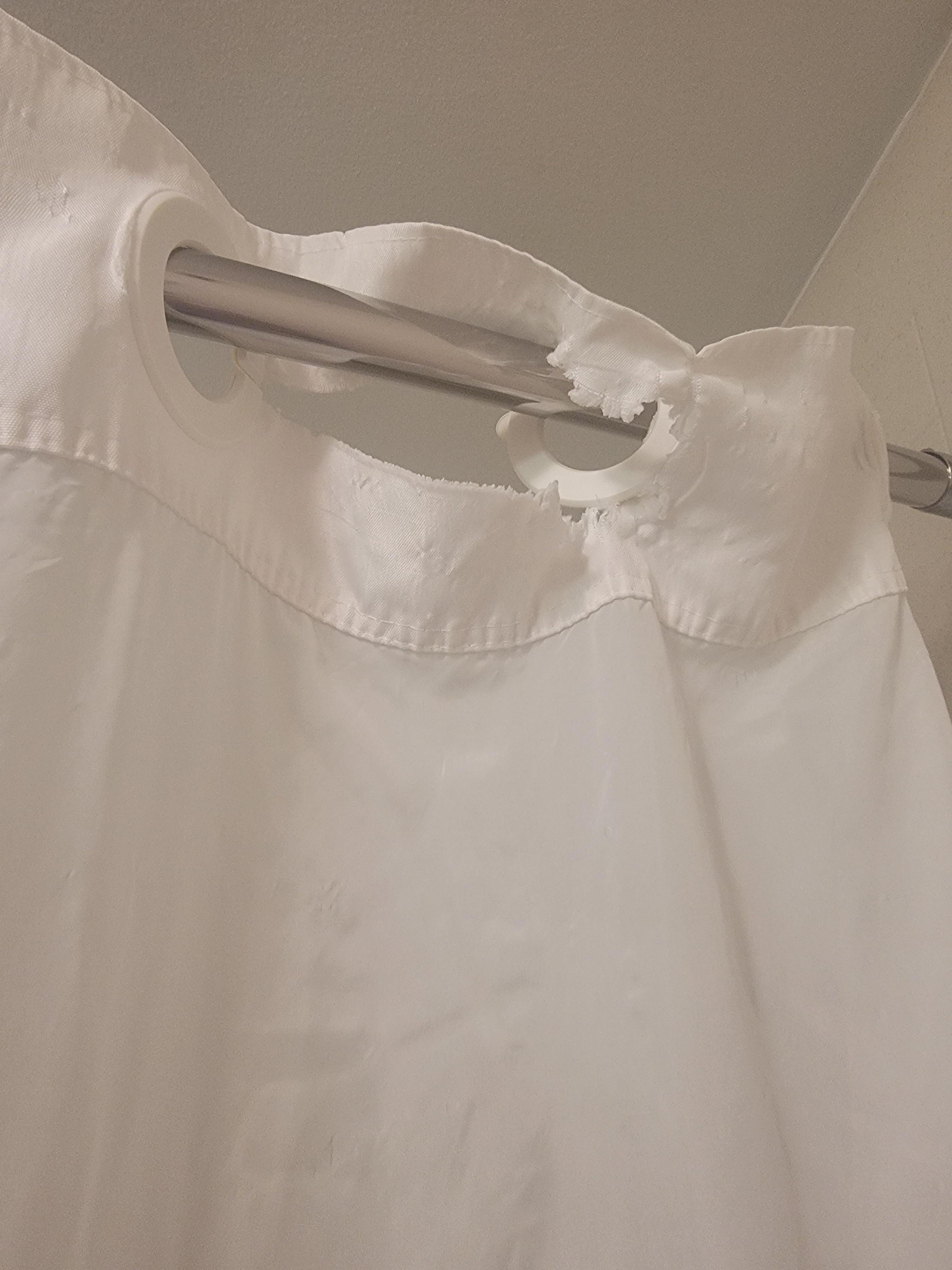 Ripped shower curtain