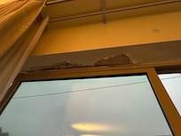 Wall cracking and falling down around window