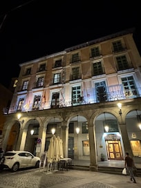 Hotel facade at night.