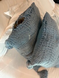 Accent pillows on our bed, yuck!