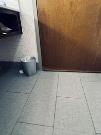 Bottom of bathroom door crumbling .