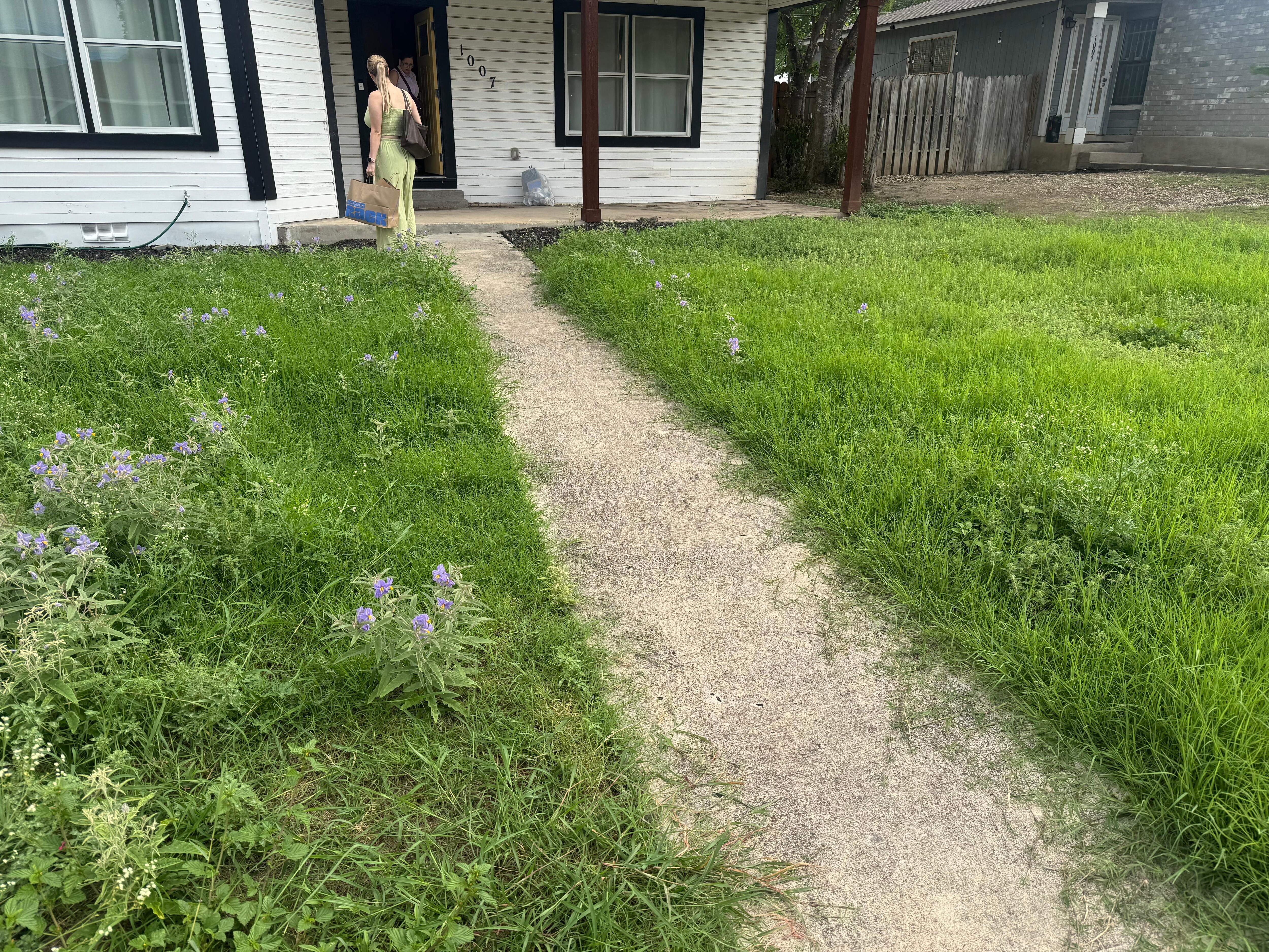 Grass was growing out to the sidewalk 