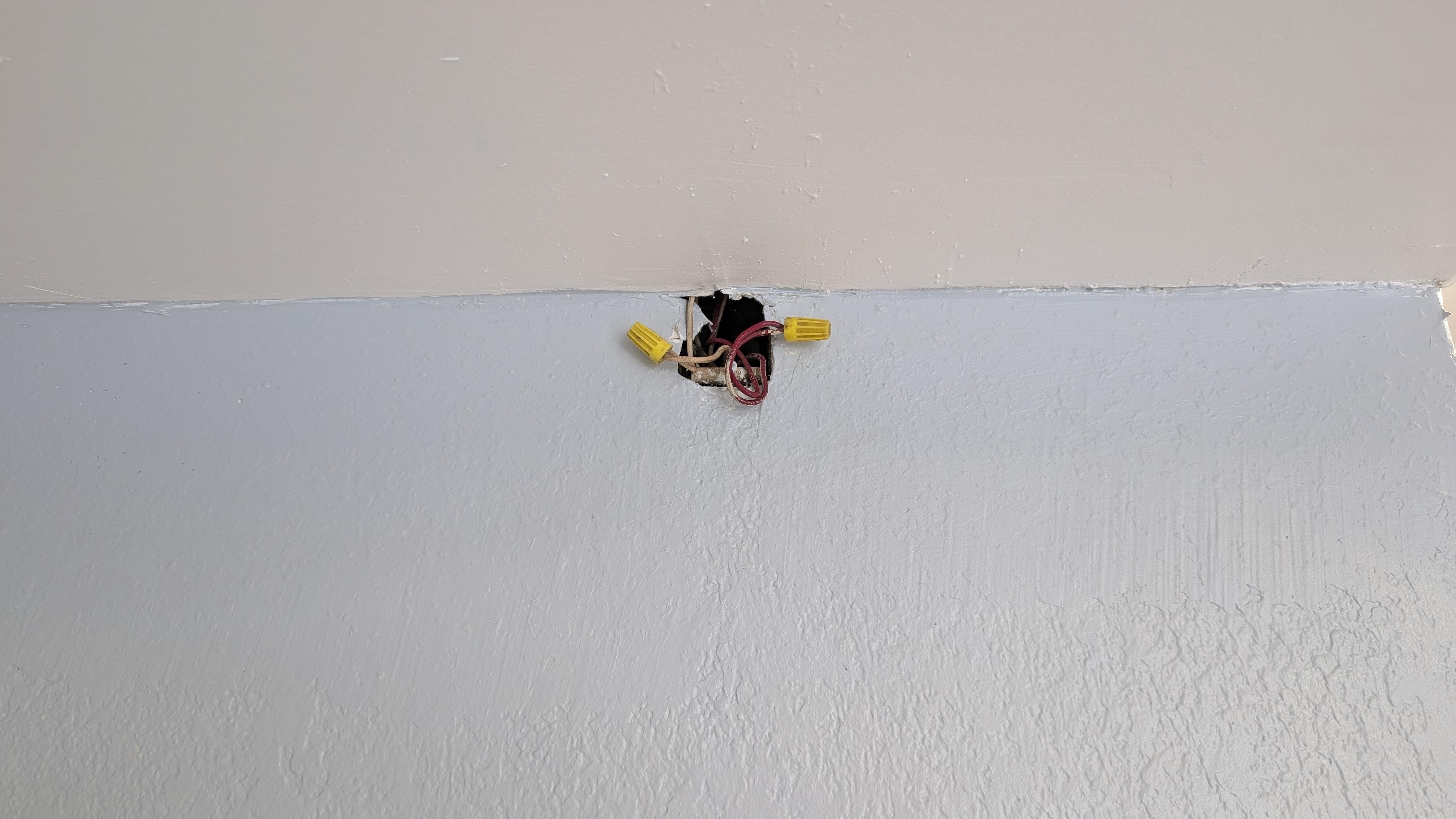 Exposed wires in main stairwell