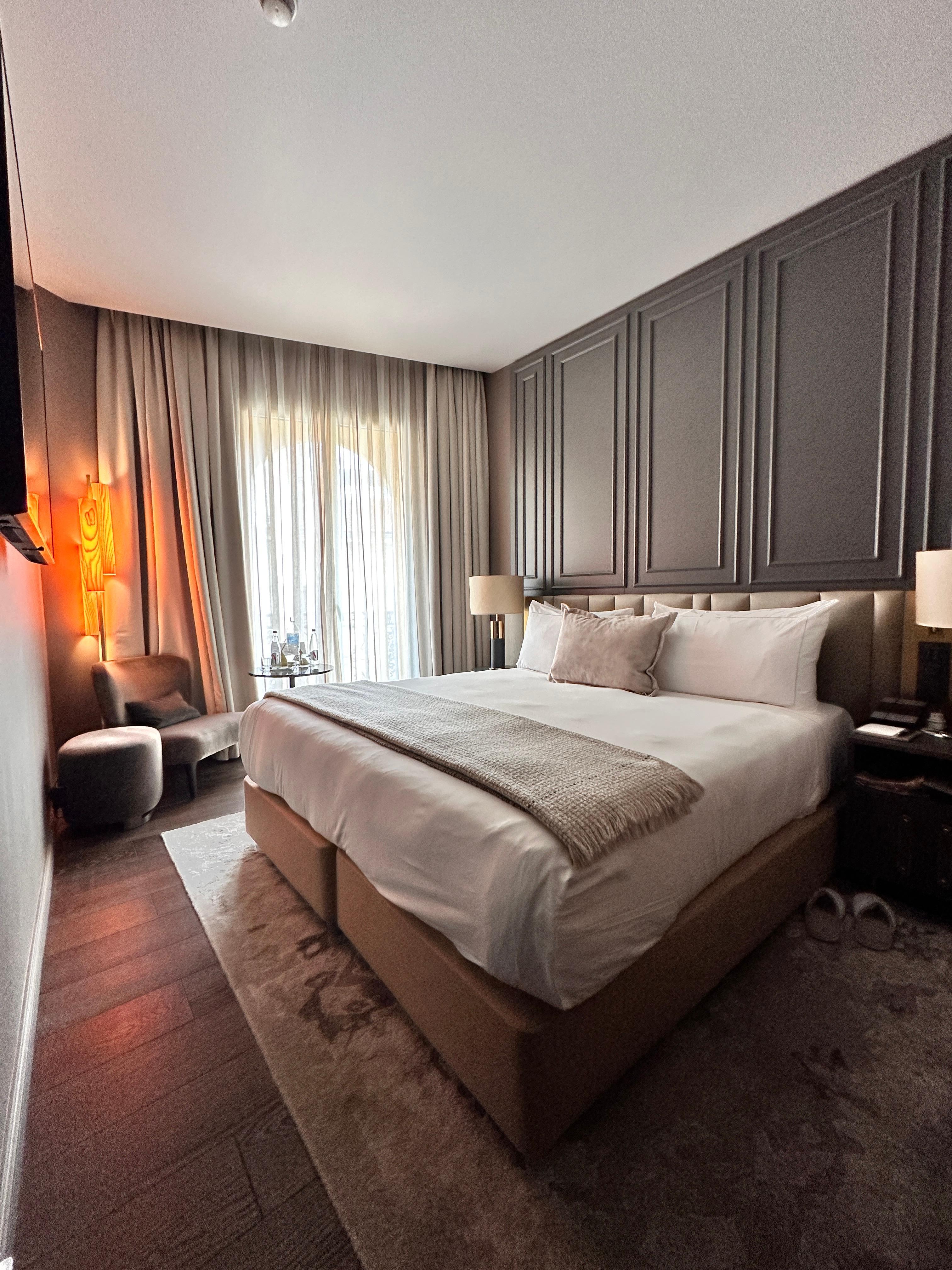 Stylish (deluxe room grand) but little space around the bed 