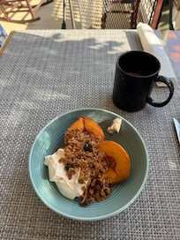Greek yogurt with homemade granola and roasted peach.