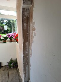 Entrance to the hotel with peeling and neglected walls