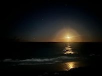 Moonrise on the platform by the water.