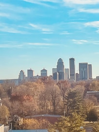 View of Louisville’s city skyline from hallway window .