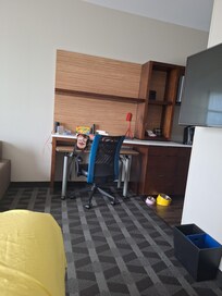 View from the King sized bed. T.V. is to the right, desk is a little bit to the right.