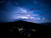 Lightning in the distance from the balcony.