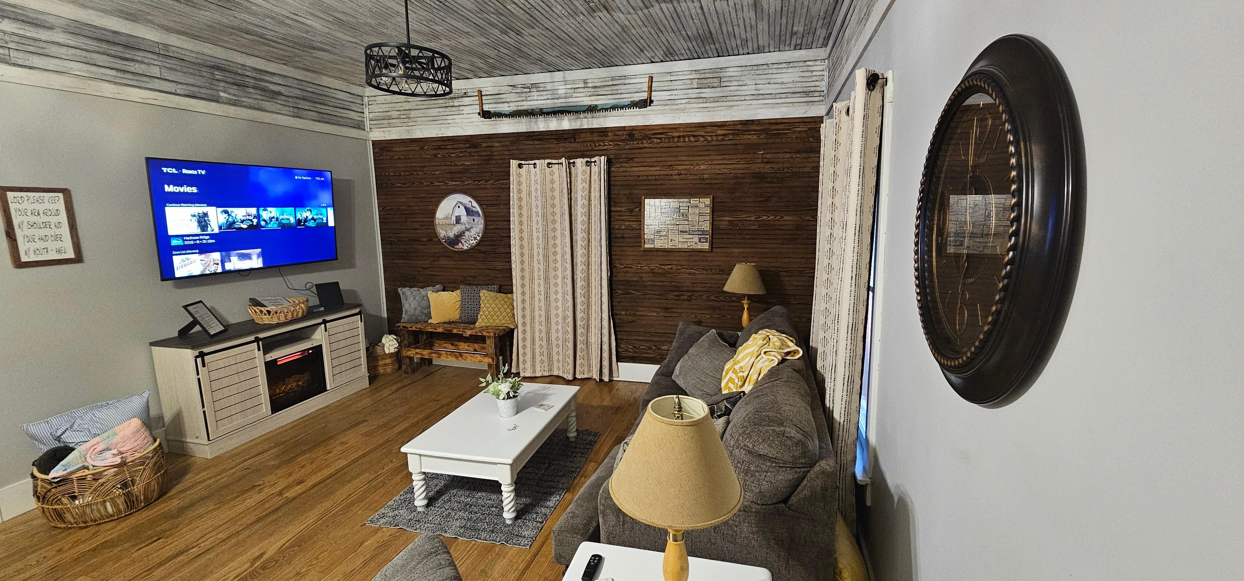 Great living space with large TV and electric fireplace. Cozy and comfy