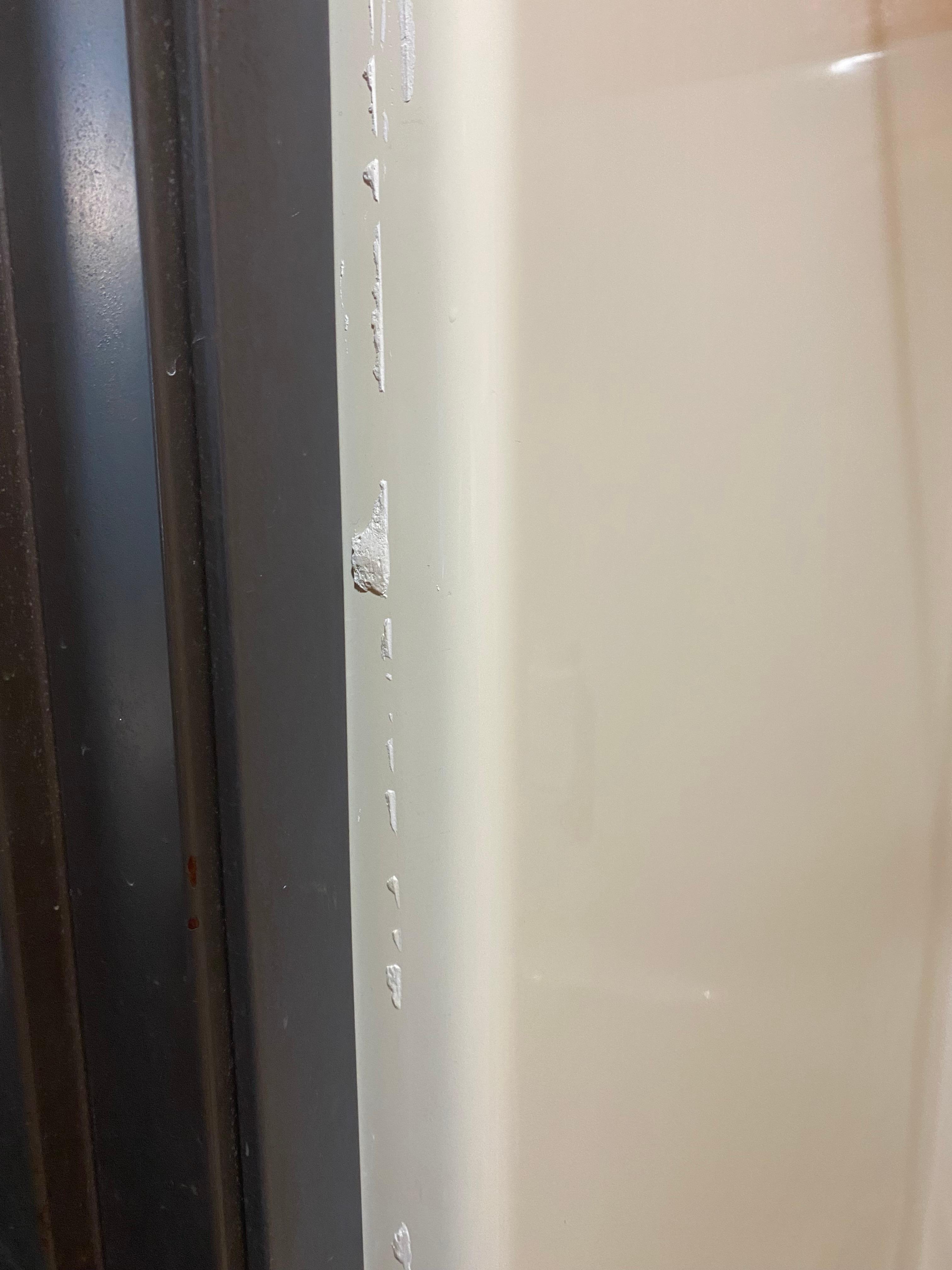 Leftover caulking by shower