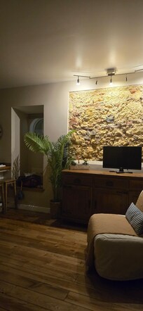 Beautiful old floors, and an area of wall where the original building materials were left exposed.